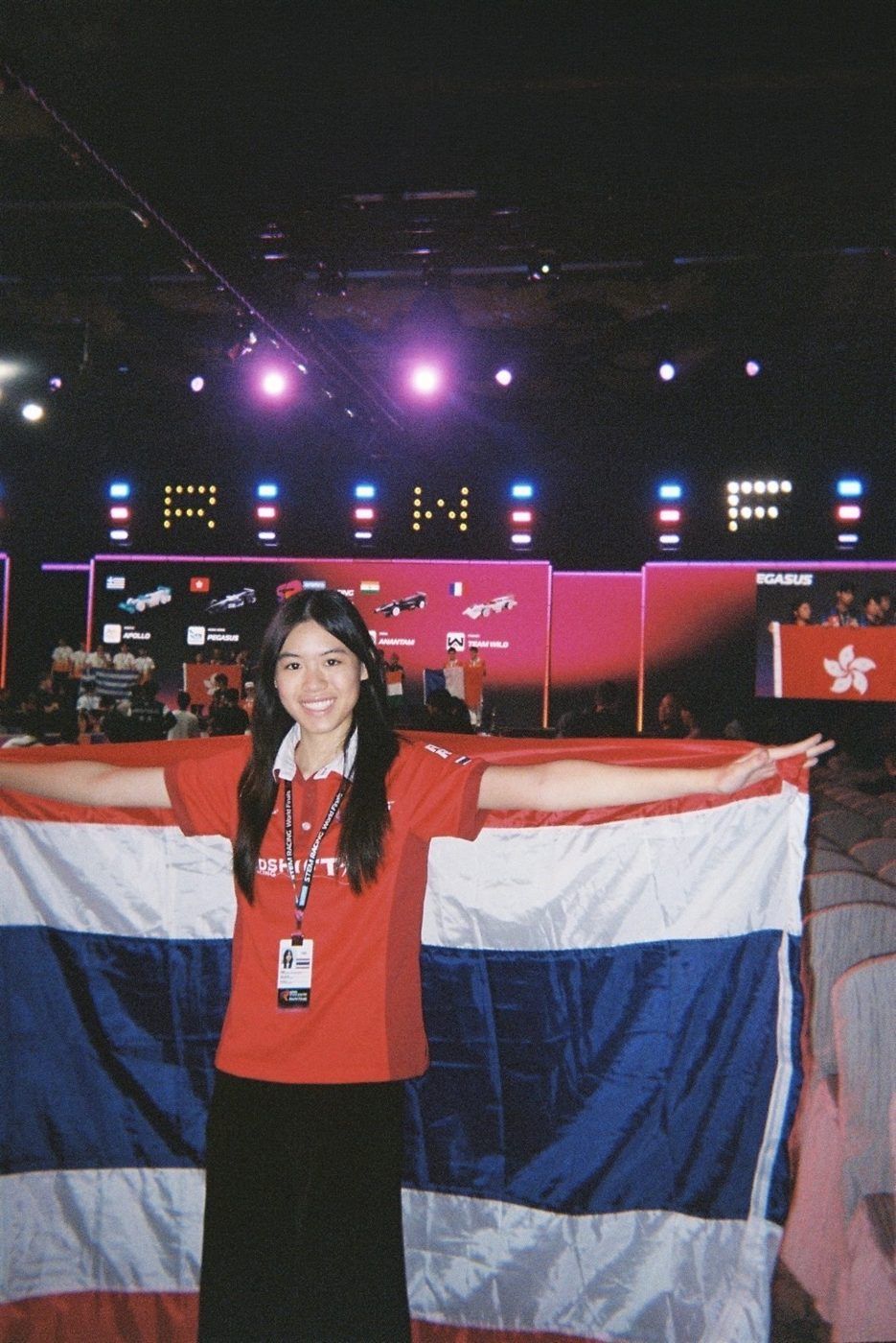 Kwankao holding the Thai flag at the STEM Racing World Finals